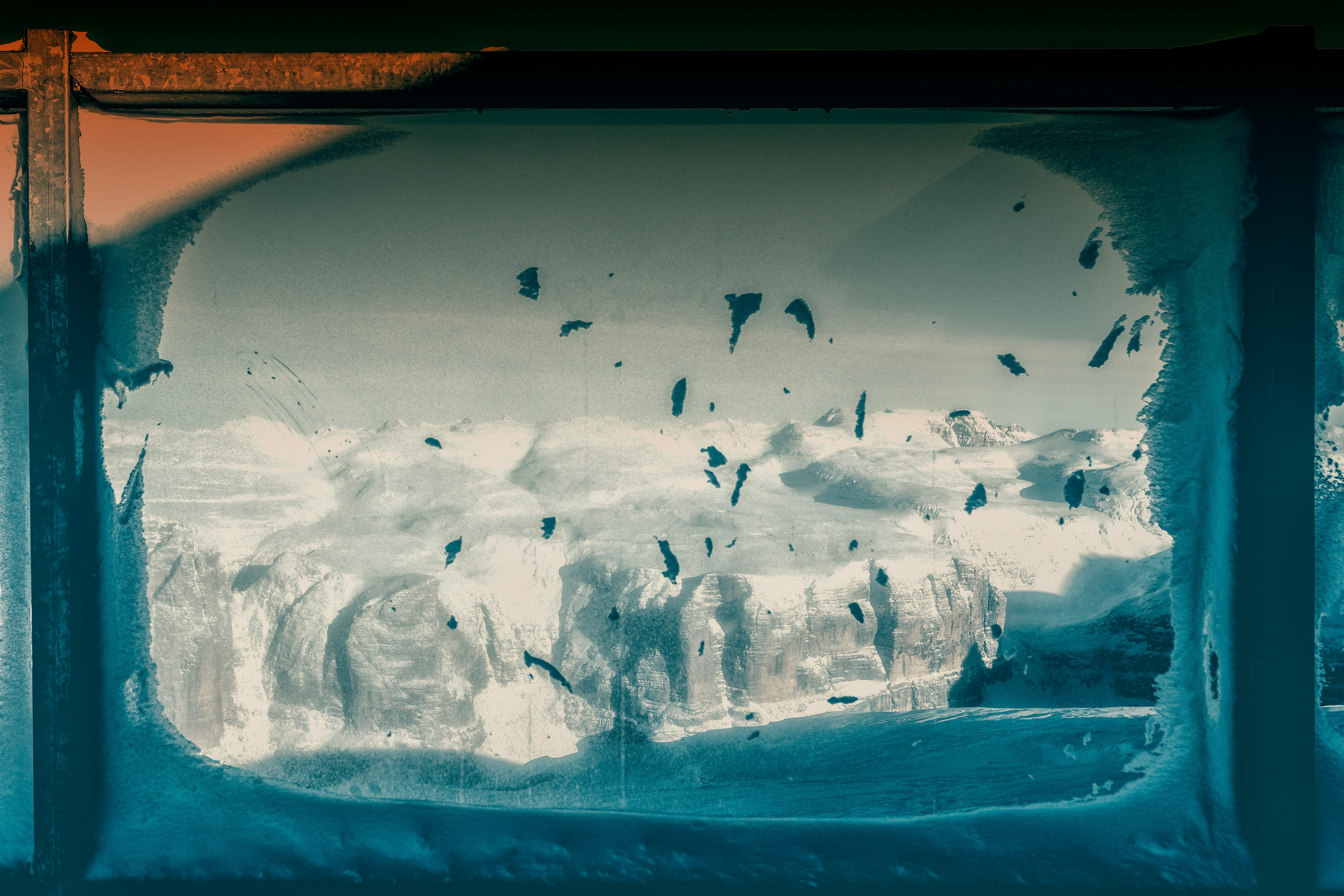 window panel with view of snow mountains